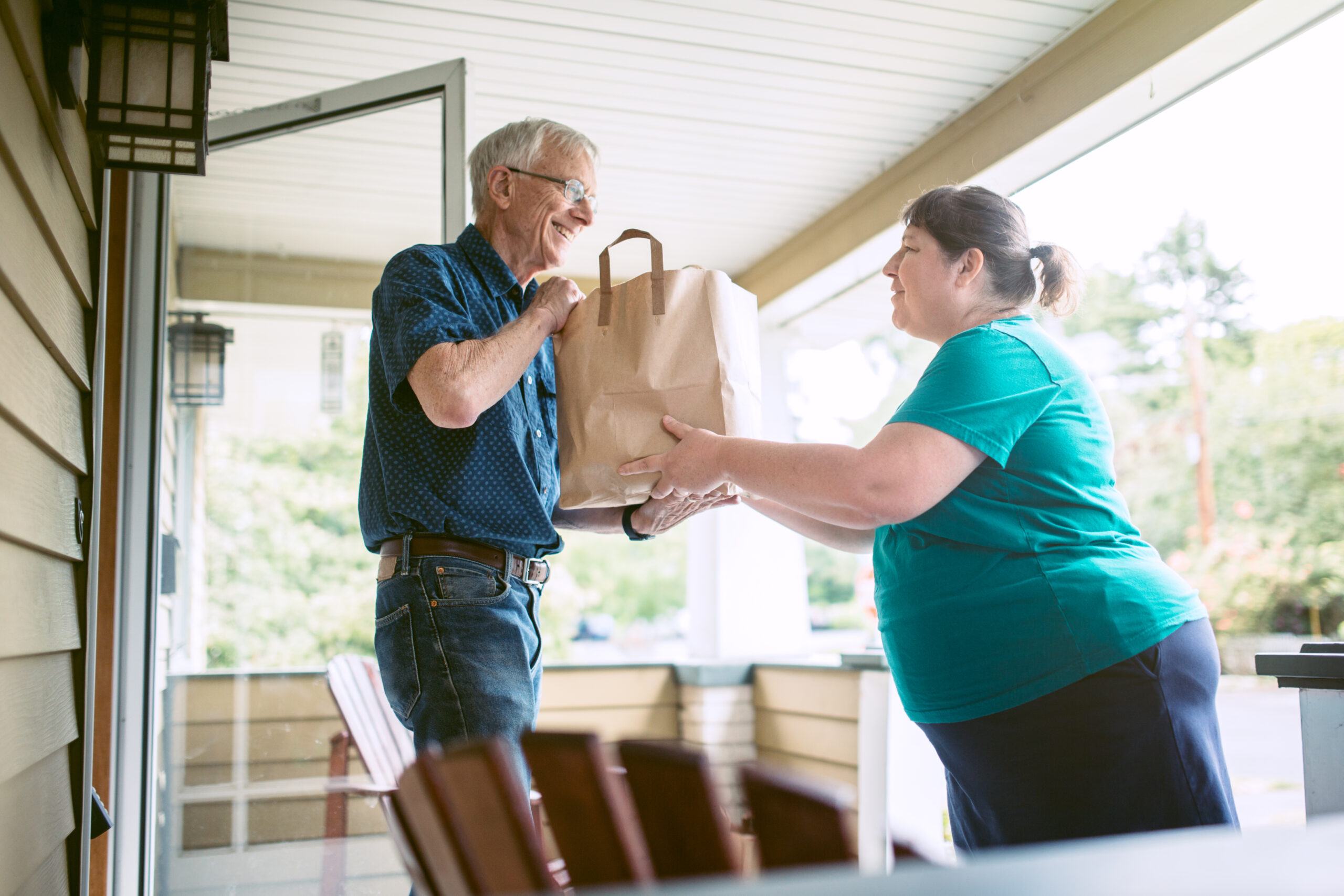 Delivering Groceries To Senior Man