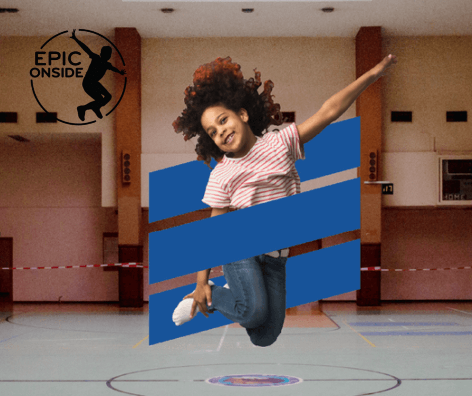 Little girl jumping in a gymnasium and having fun